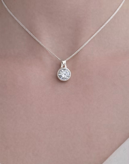 Secretly set silver round pendant